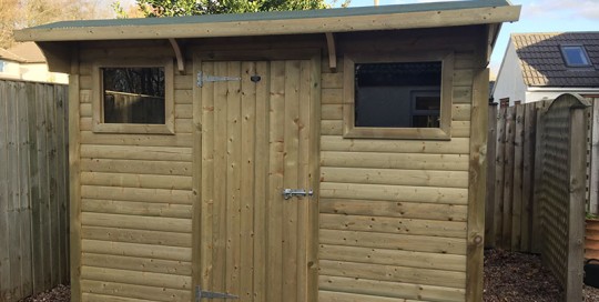 Bespoke shed with double front windows by Empress Fencing